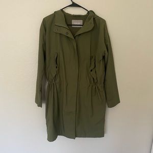 Green Everlane rain jacket